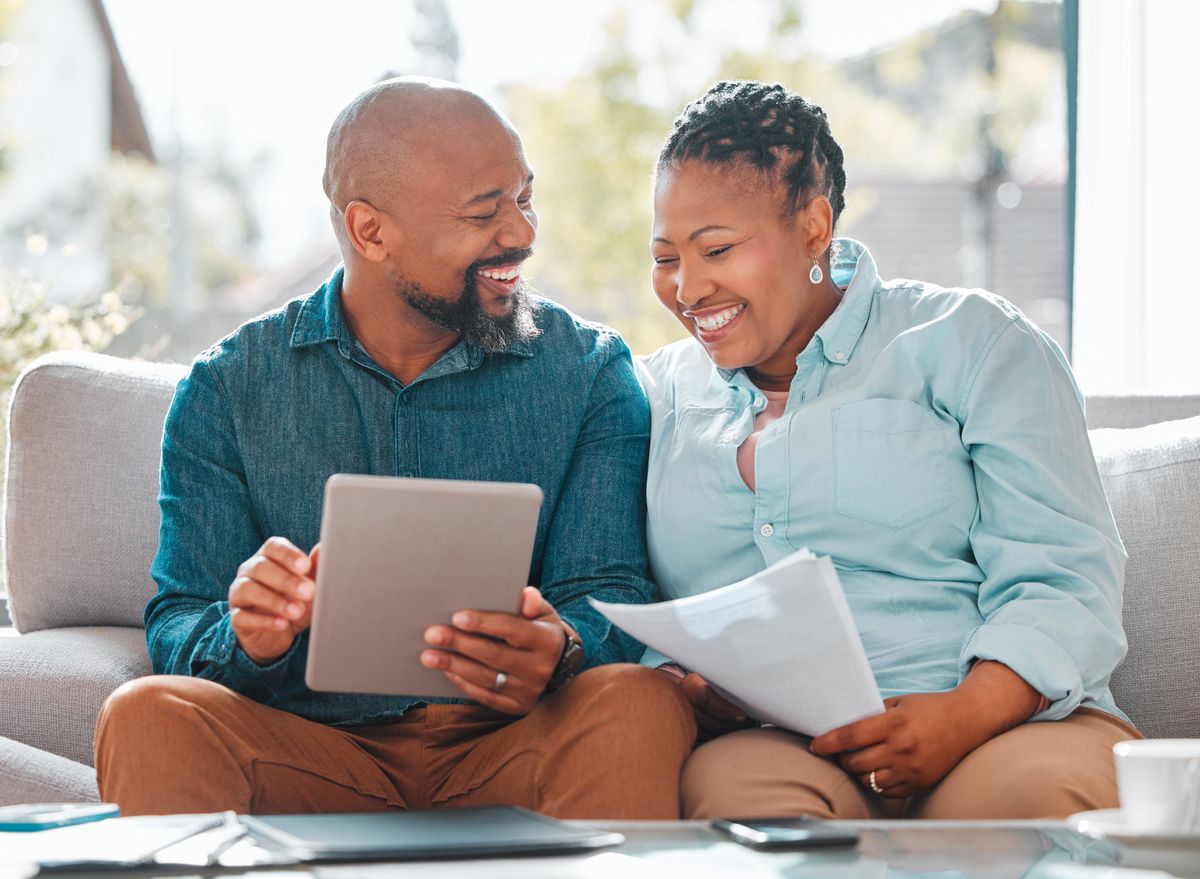 Couple reviewing their financial plan together on a tablet