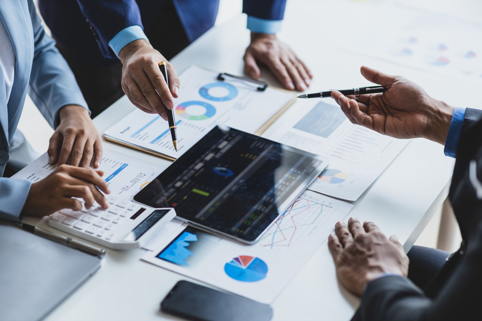 Business professionals reviewing financial charts